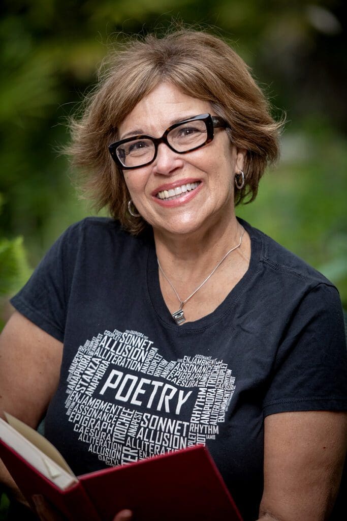 A woman with glasses and a black shirt